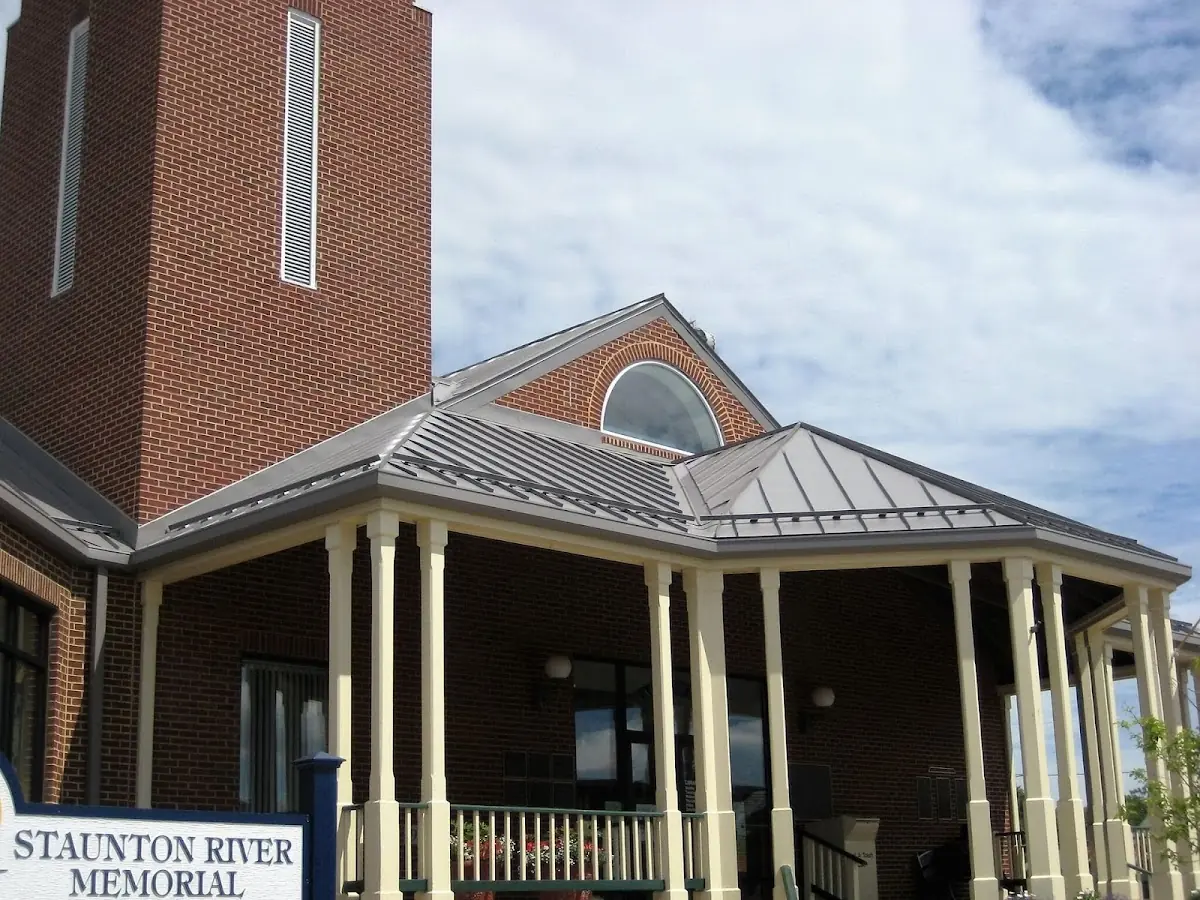 Skilled roofing craftsmen working on a residential roof in Penn State Campus